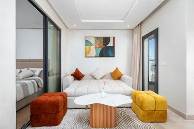 a living room with a couch and a table at Modern Comfortable Apartment - Corniche Hassan II in Casablanca