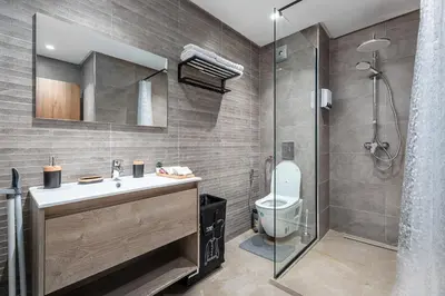 a bathroom with a toilet and a shower at Modern Comfortable Apartment - Corniche Hassan II in Casablanca