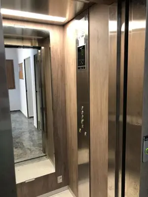 a row of elevators in an elevator in a building at Cozy Studio with pool, fiber optics in Mansouria