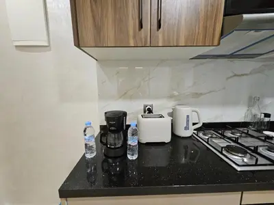 a kitchen counter with a coffee maker and a toaster at Casablanca premium Suite,wifi,parking in Casablanca