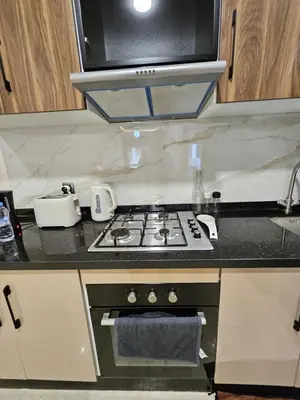 a kitchen with a stove and a microwave at Casablanca premium Suite,wifi,parking in Casablanca