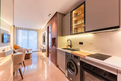 a kitchen with a washer and dryer in a room at Princesses Luxury Studio - Elegance & Light in Casablanca