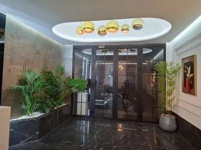 an elevator lobby with plants in a building at New 8th floor Terrace 5 min from train stations in Casablanca