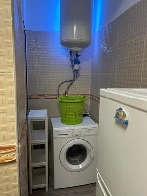 a washing machine with a basket on top of it at Apartamento Temara Morroco in Temara