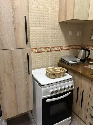 a kitchen with a stove top oven in a kitchen at Apartamento Temara Morroco in Temara