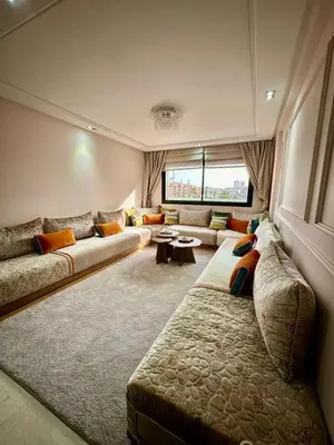 a living room with two couches and a window at Twin Center View Apt in Maarif in Maarif