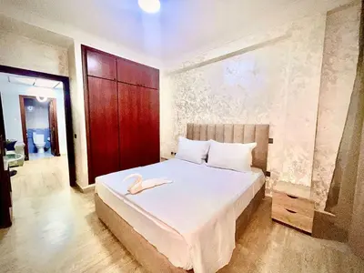 a bedroom with a bed with a swan on it at Modern Central Apartment in Casablanca in Casablanca