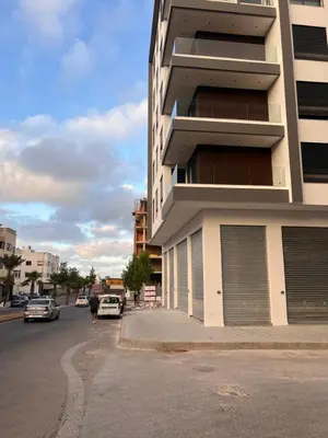 a building on the side of a street with cars at Proche chekh khalifa KLIVING Studio in Casablanca