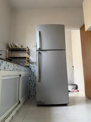 a stainless steel refrigerator in a kitchen at Résidence Haja in Casablanca