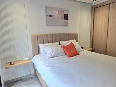 a bedroom with a large white bed with two pillows at VIVASTAY Casablanca - Metropole Bd Abdelmoumen in Casablanca