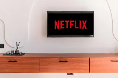 a tv on a wall with the netflix sign on it at Studio Signature - Parking privé & neuf in Casablanca