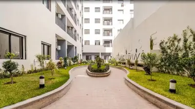 a walkway in front of a building at Studio Signature - Parking privé & neuf in Casablanca
