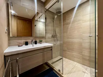 a bathroom with a sink and a shower at Luxurious 1BR Orangeraie - Terrace & Pool in Oulad Akkou