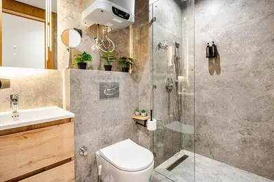 a bathroom with a shower and a toilet and a sink at CFC new Appartement Central Anfa Park roof top free parking in Casablanca