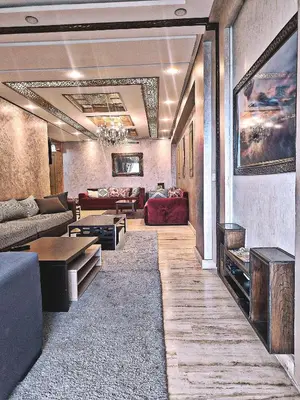 a living room with a couch and a table at Casablanca House hassan2 in Casablanca