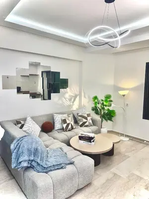 a living room with a couch and a table at Modern Studio Centre Casa belvédère Tramway & Train Station in Casablanca