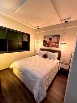 a bedroom with a large white bed and a window at Modern Studio Centre Casa belvédère Tramway & Train Station in Casablanca