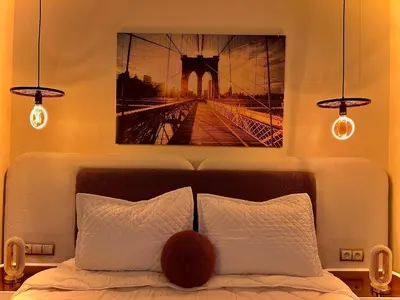 a bedroom with a bed with a picture on the wall at Modern Studio Centre Casa belvédère Tramway & Train Station in Casablanca