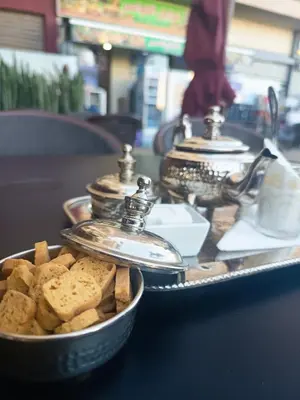 a tray of food with cookies on a table at Nouaceur Suite avec Piscine Casa Aéroport AirNest in Nouaseur
