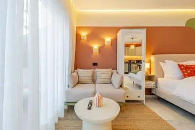 a living room with a couch and a bed at Loft - Literie Premium, Fibre optique, IPTV, GYM, Terrasse in Casablanca