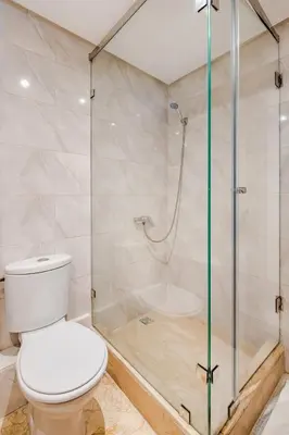 a bathroom with a toilet and a shower at Agdal Train Station Modern&Stylish Apartments in Rabat
