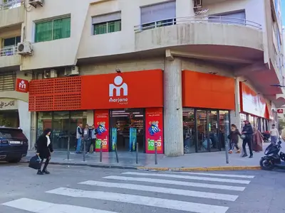a store on a street with people walking in front of it at A Pleasant escape In Morocco in Casablanca