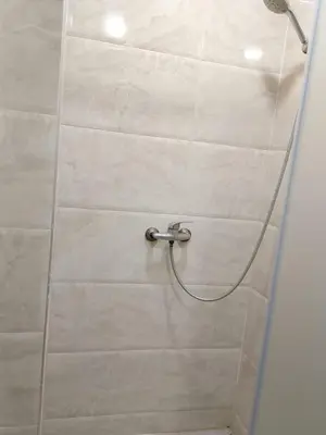 a shower with a glass door in a bathroom at Confort et mer Océan Rabat in Rabat