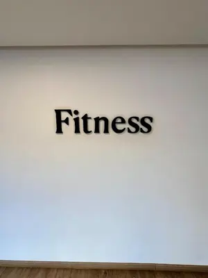 a sign on a wall with the word fitness on it at Luxury Apartment with a Stunning Sea View - Rabat in Rabat