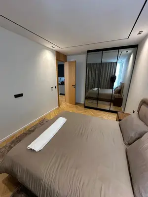 a bedroom with a large bed and a couch at Casablanca Maarif in Casablanca