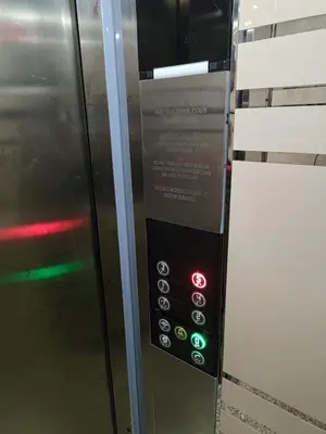 a microwave oven with a sign on the side of it at 2 min walk from Four Seasons Hotel-Cozy Terrace Stay in the Heart of Rabat in Rabat