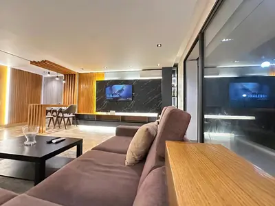 a living room with a couch and a table at RDJ 2CH haut standing - Bouskoura in Bouskoura