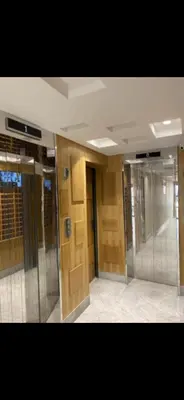 a hallway of a building with wooden walls and doors at Studio lumineux et cosy in Casablanca