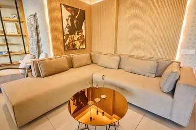 a living room with a couch and a table at Terrasses and Sunset Duplex Luxe 3 Bed in Ghandi in Casablanca