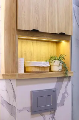 a wooden cabinet with two plants on a shelf at Le Nour- 2 modern bedrooms Luxury and Comfort in Bouznika