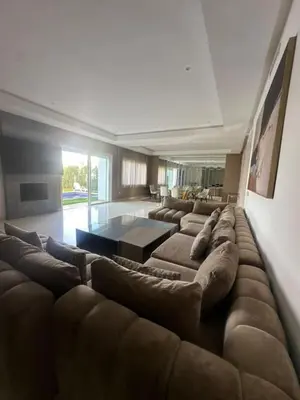 a large living room with a large couch at A beautiful luxury villa in Rabat in Aïn el Apuda