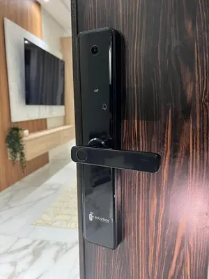 a black refrigerator door with a television in a room at Appartement neuf vue mer sur la corniche in Rabat