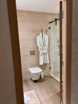a bathroom with a toilet and a shower at Appartement neuf vue mer sur la corniche in Rabat