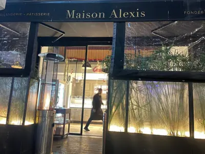 a person walking past a building with a sign on it at Studio a 2 pas des TWINS CENTER boulevard Massira Khadra in Casablanca