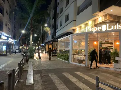 a store on a city street at night at Studio a 2 pas des TWINS CENTER boulevard Massira Khadra in Casablanca
