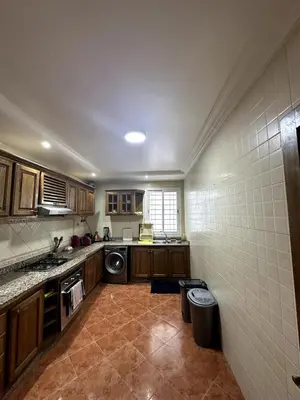 a kitchen with a washer and dryer in a room at La Perle Aïn Diab Beachfront in Casablanca