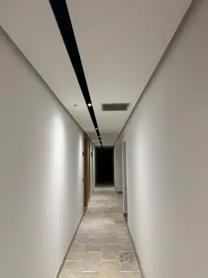 an empty corridor with white walls and a ceiling at 2 bedrooms in the heart of Casablanca in Casablanca