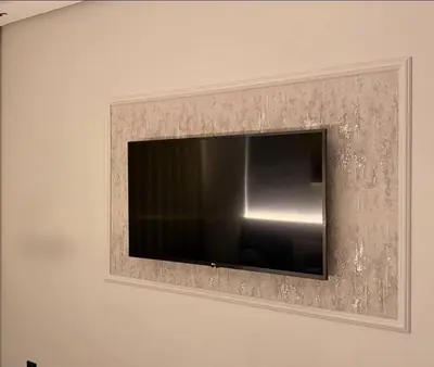 a flat screen tv on a wall at 2 bedrooms in the heart of Casablanca in Casablanca