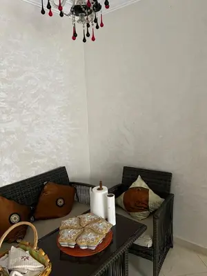a table with a tray of pastries on top of it at Cozy & calm in Bouznika