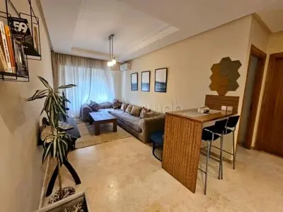 a living room with a couch and a table at A Comfortable Escape In Morocco in Casablanca