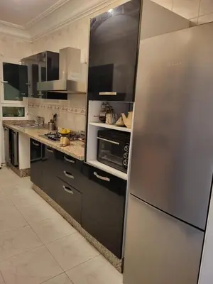 a kitchen with a stainless steel refrigerator and stove at Appartement chic de 3 chambres au cœur de Casablanca in Casablanca