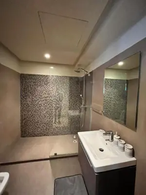 a bathroom with a sink and a shower at residence socrate in Casablanca