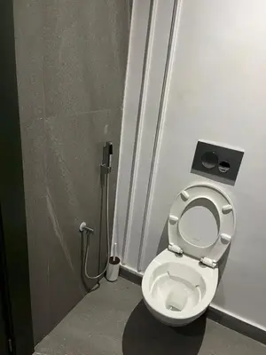 a bathroom with a toilet in a stall at Studio Les princesses in Maarif