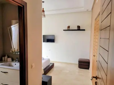 a bathroom with a sink and a toilet in a room at Moroccan Sunset - Charming 3BR near Airport Med 5 in Nouaseur