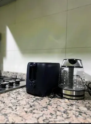 a toaster sitting on top of a kitchen counter at Moroccan Sunset - Charming 3BR near Airport Med 5 in Nouaseur
