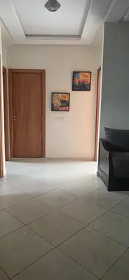 an empty room with a door and a tile floor at luxury apartment DT2 in Mohammedia
